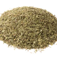 Close-up view of our Oregano Leaf Rubbed Dried, showcasing the vibrant green color and fine texture. Elevate your cooking with this premium herb, adding a touch of aromatic magic to your favorite recipes.